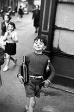 Henri Cartier-Bresson captures a street scene in his <i>Rue Mouffetard, Paris</i> (1954)