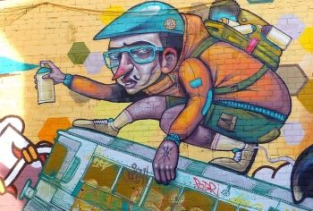 A caricature of a graffiti artist at work - Girona Spain