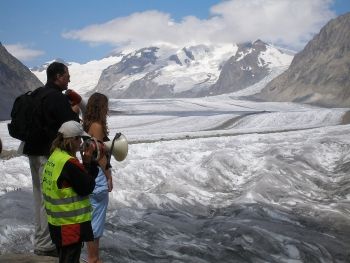 Spencer Tunick with wife Kristin Bowler and a Greenpeace member, preparing for a photo shoot at the Aletsch Glacier in Switzerland, 2007