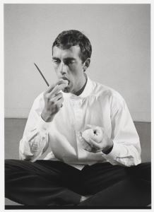 <i>David Wojnarowicz Eating an Apple</i>, photograph by Peter Hujar, 1983.