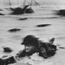 Robert Capa: FRANCE. Normandy. June 6<sup>th</sup>, 1944. US troops assault Omaha Beach during the D-Day landings (first assault) (1944)