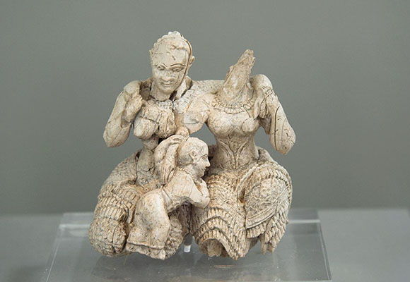 Ivory figurine representing three females (1400-1200 BCE)