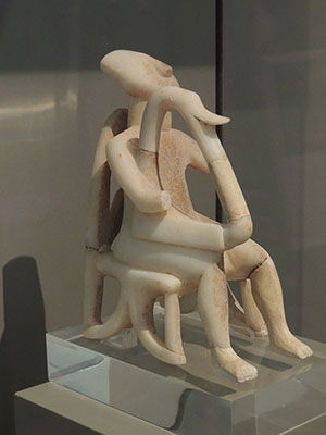 Marble statuette of a male figure playing a musical instrument, lyre or harp (2800 - 2300 BC)