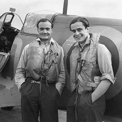 Two Battle of Britain fighter pilots, Flight Lieutenant Brian Kingcome (left), commanding officer of No. 92 Squadron Royal Air Force and his wingman, Flying Officer Geoffrey Wellum, next to a Supermarine Spitfire at RAF Biggin Hill, Kent (1941)