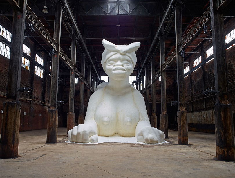 A Subtlety, or the Marvelous Sugar Baby an Homage to the unpaid and overworked Artisans who have refined our Sweet tastes from the cane fields to the Kitchens of the New World on the Occasion of the demolition of the Domino Sugar Refining Plant (2014)